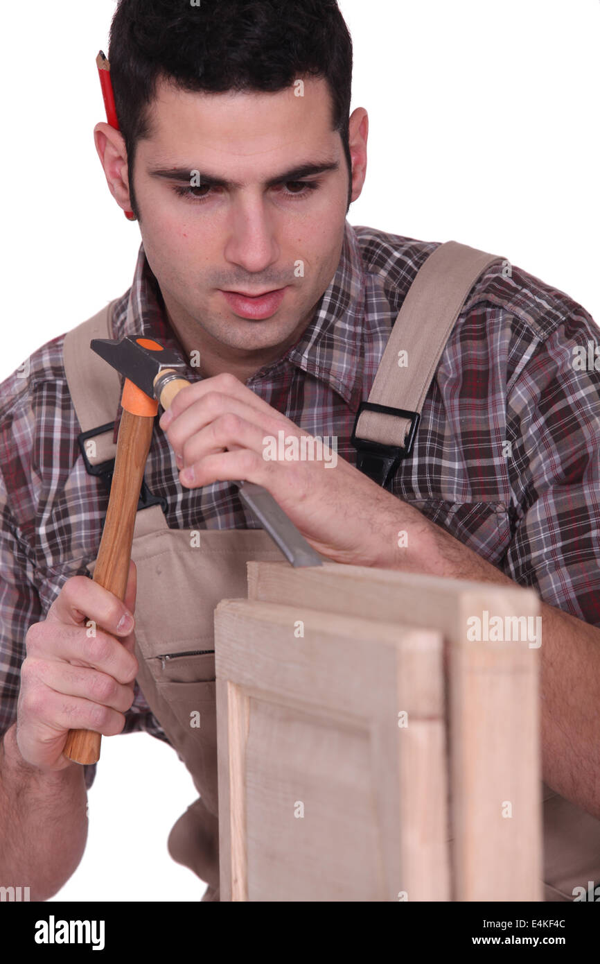 Man using hammer and chisel Stock Photo Alamy