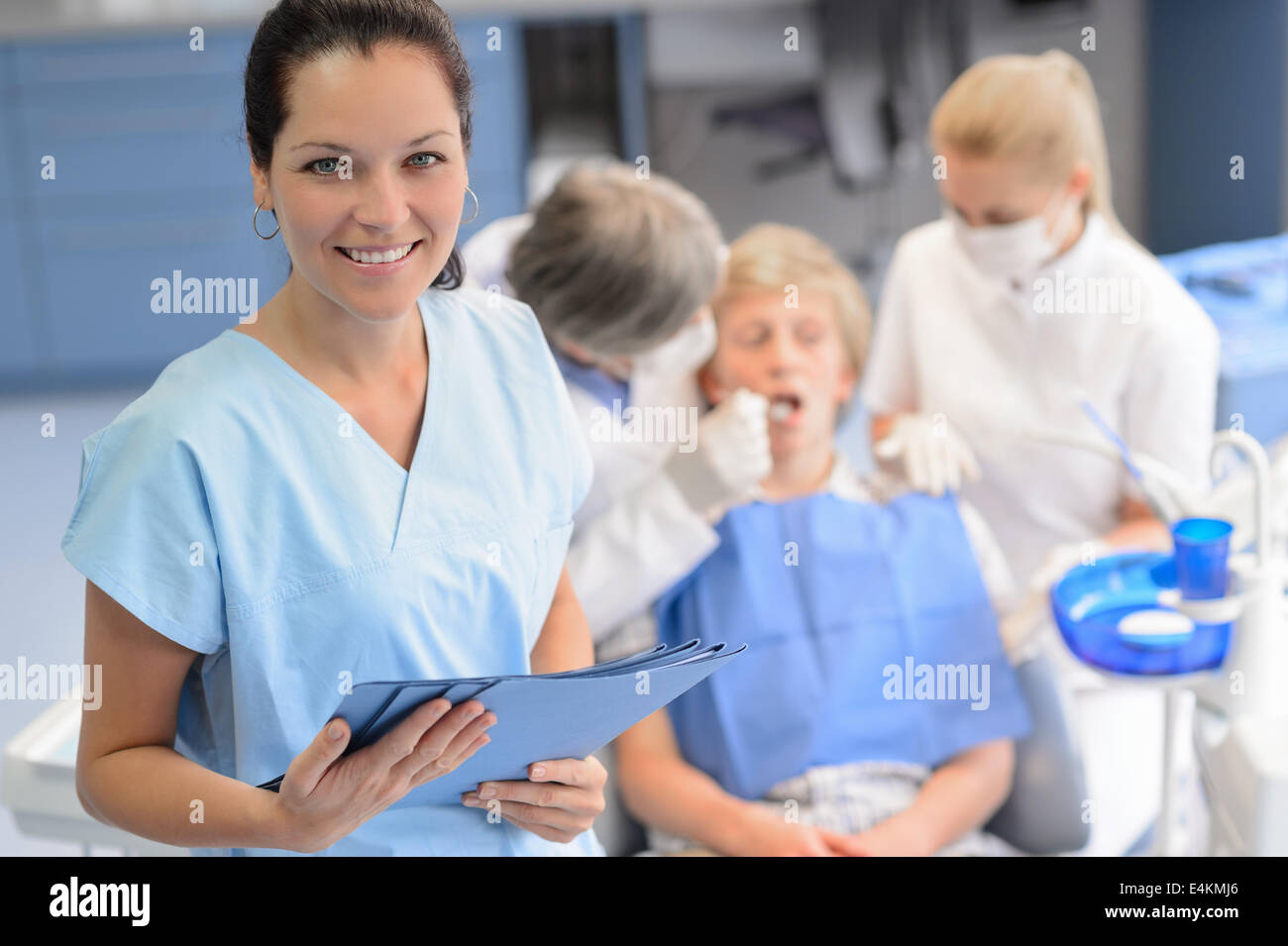 Professional dentist  team checkup teenage patient boy at dental surgery Stock Photo