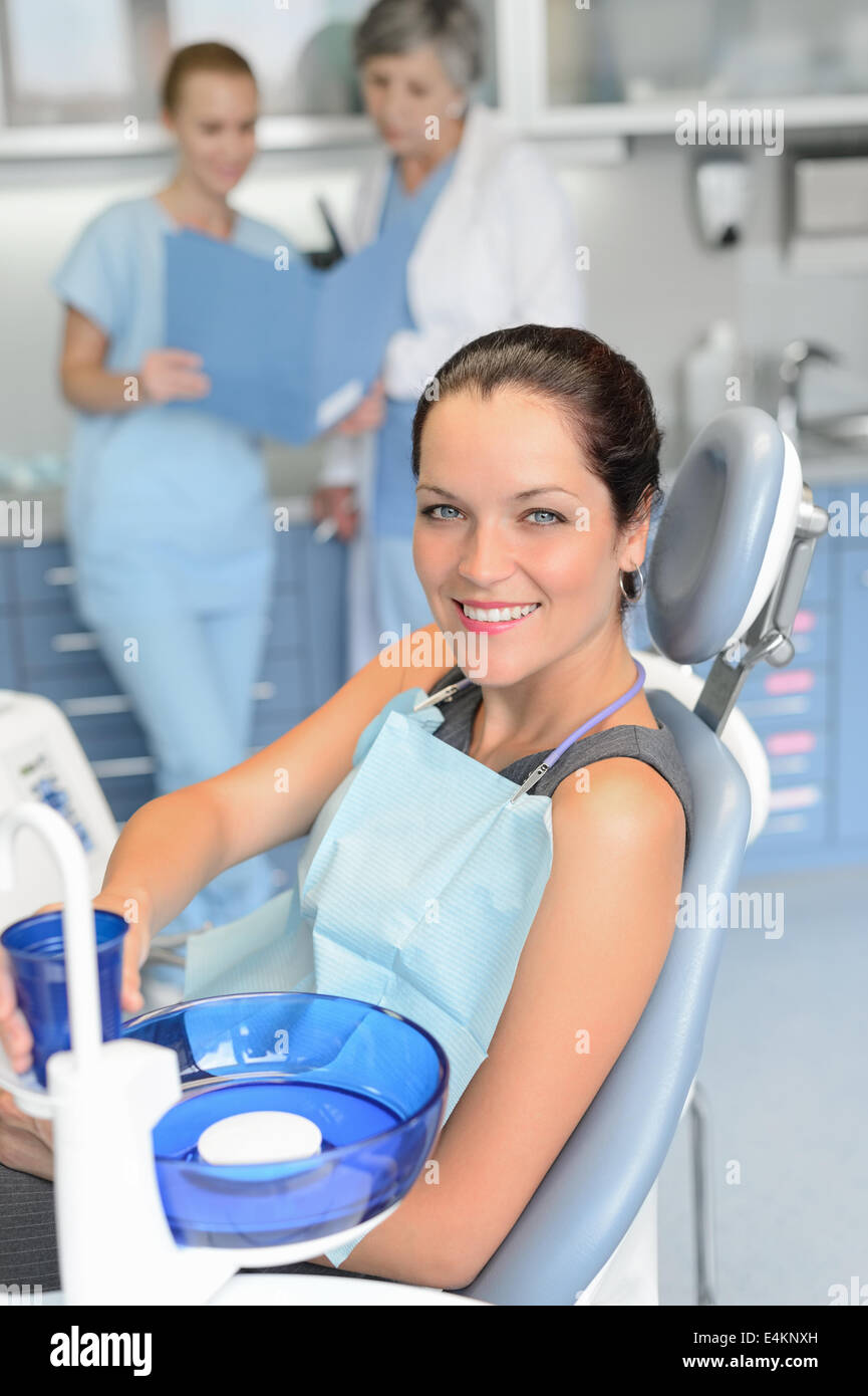 Woman patient sitting chair dental surgery checkup professional dentist