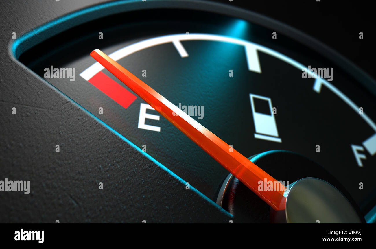 A closeup of a backlit illuminated gas gage with the needle indicating an empty tank on an isolated dark background Stock Photo