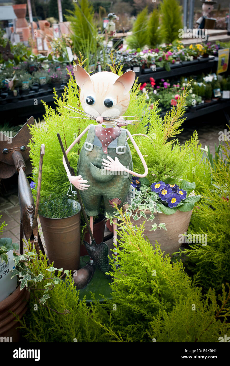 Amusing garden figure for sale in an English garden centre. Attention seeker Stock Photo