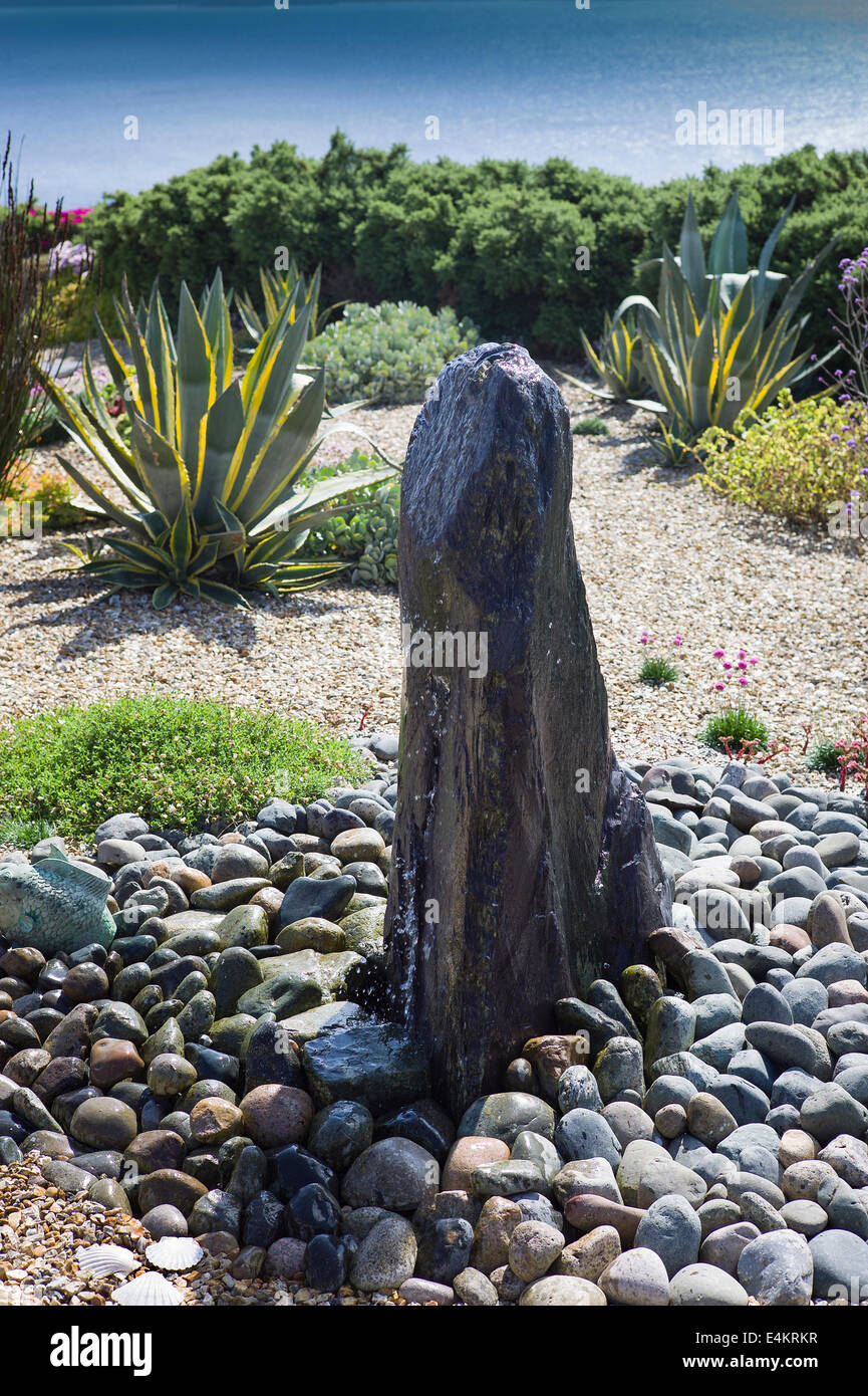 A simple coastal garden with low-maintenance a feature of its design Stock Photo