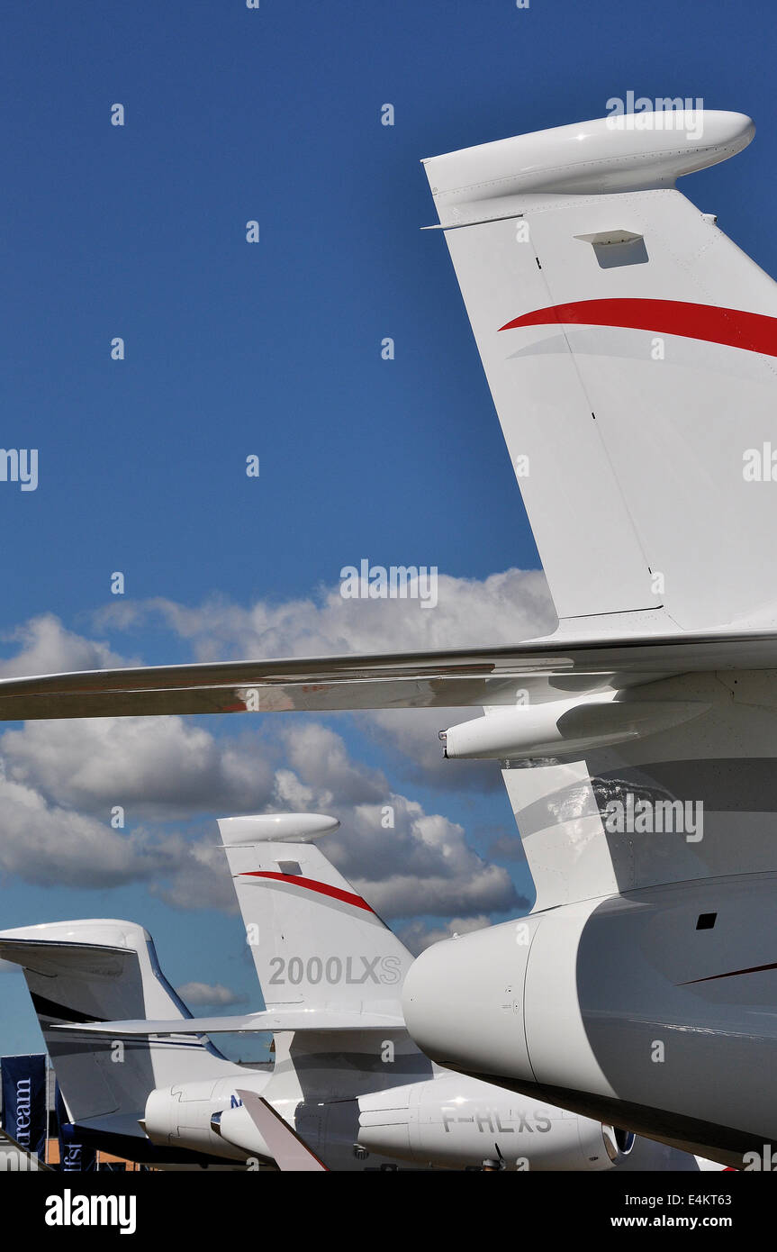Corporate jets at the Farnborough International Airshow. Tails lined up of private jets, business jets, bizjets. Dassault Aviation Planes Stock Photo