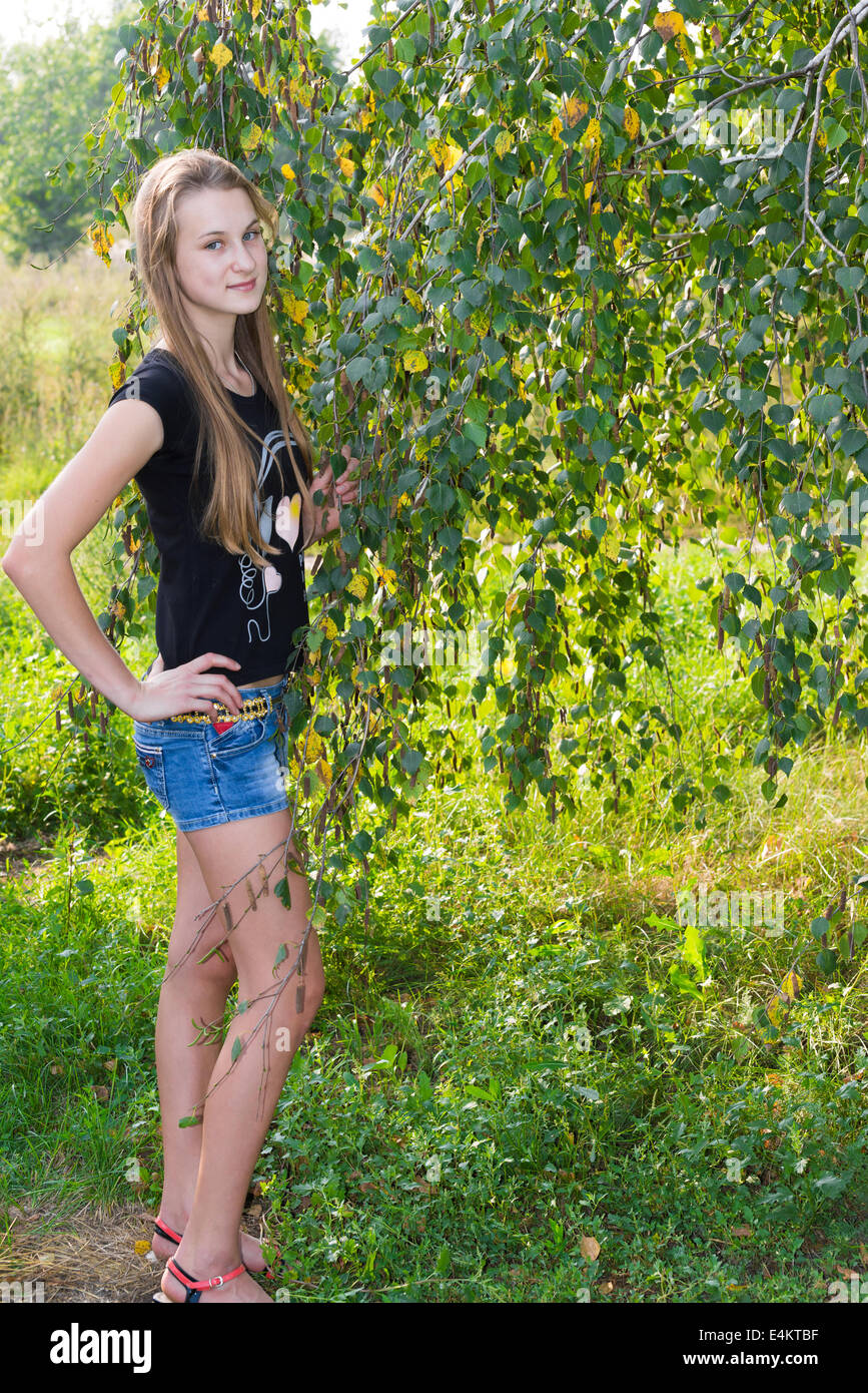 Teen girl near the birch Stock Photo - Alamy