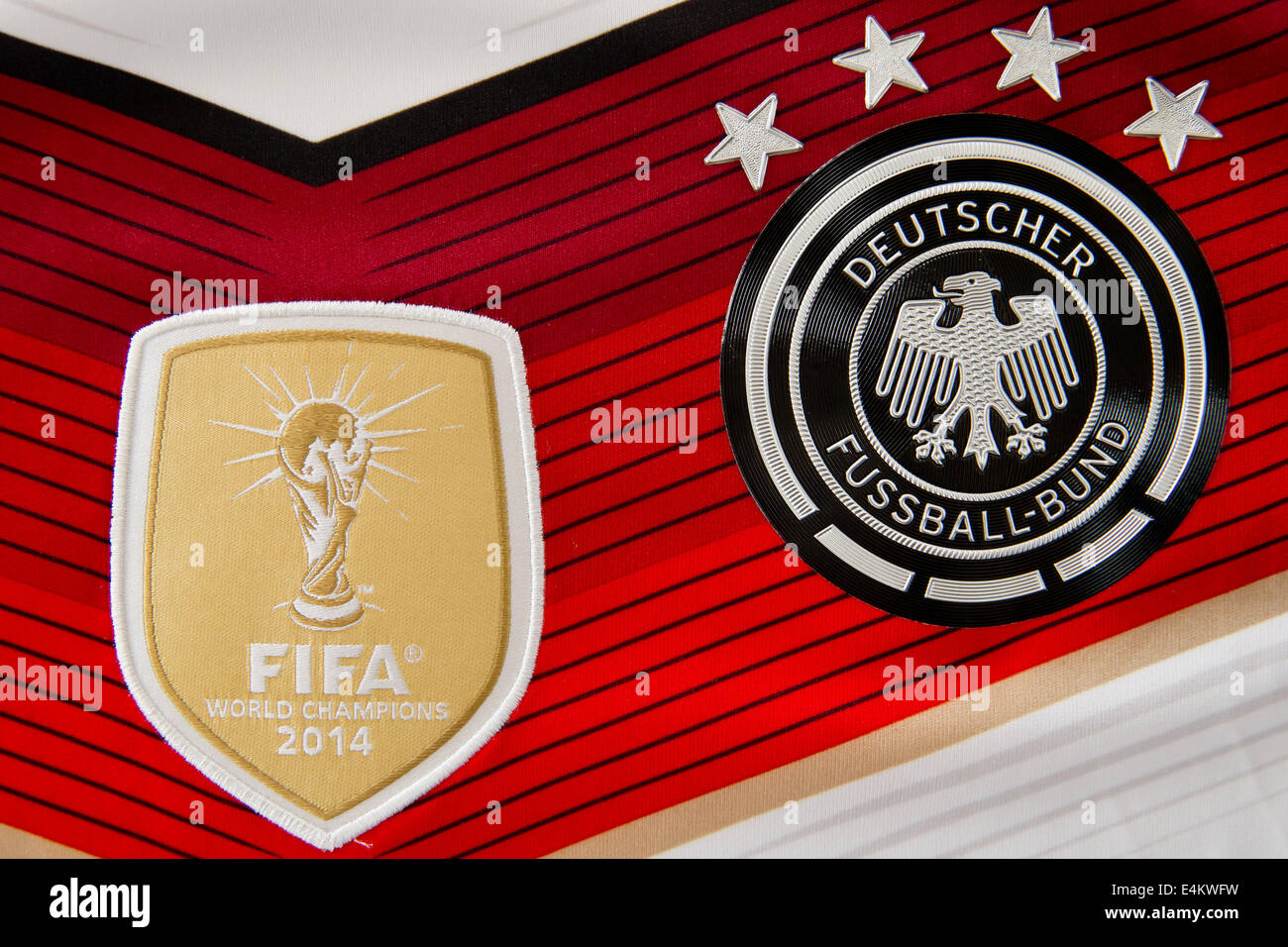 Herzogenaurach, Germany. 14th July, 2014. The fourth star is shown on the official jersey of the German national team in Herzogenaurach, Germany, 14 July 2014. On the left the World Cup trophy with the writing FIFA World Champions 2014 is pictured on the jersey. Germany won the FIFA World Cup 2014 Final 1-0 over Argentina. Every star signifies a won World Cup title. Photo: Daniel Karmann/dpa/Alamy Live News Stock Photo