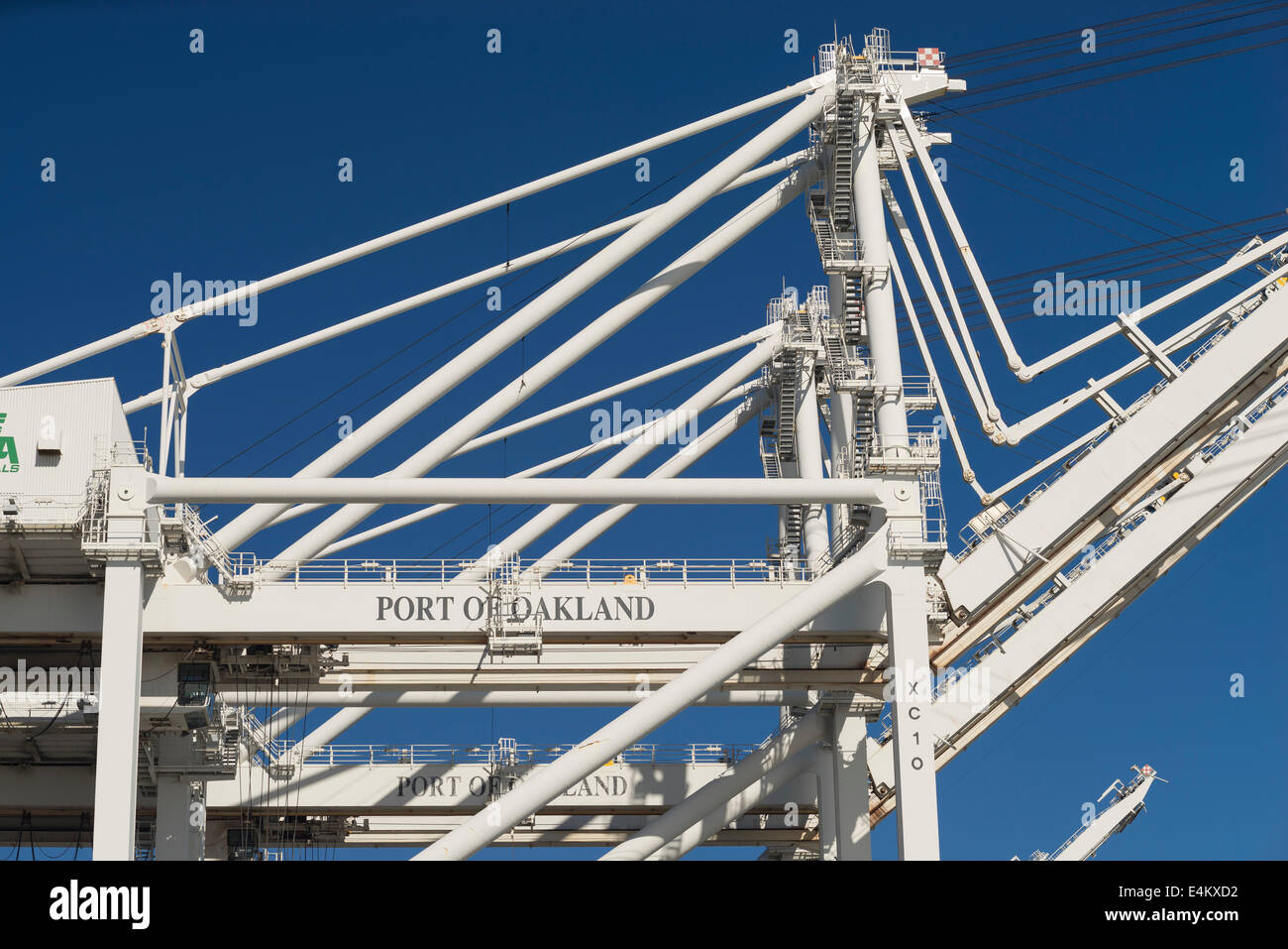 Cargo loading cranes and shipping containers at the Port of Oakland. Stock Photo