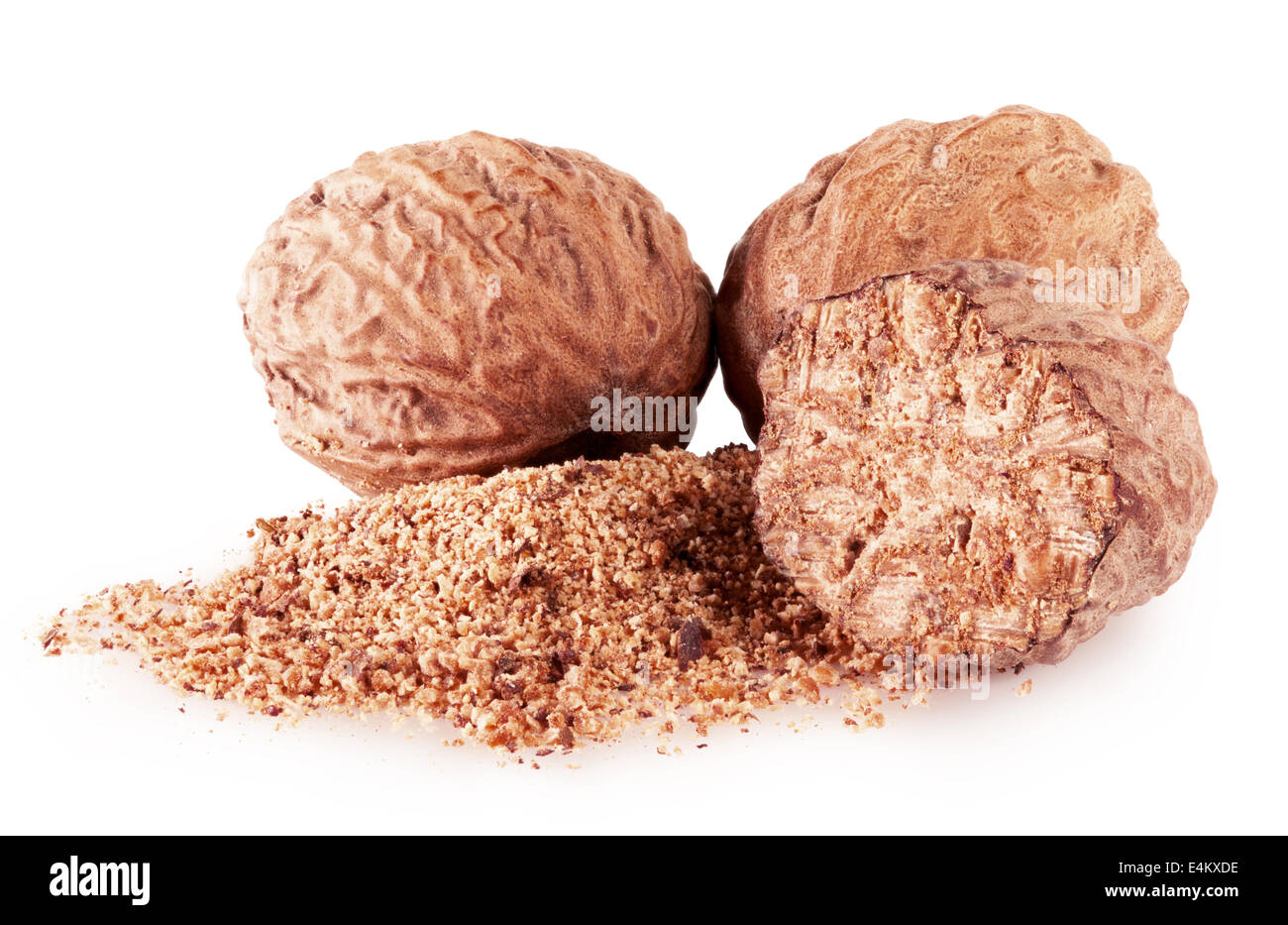 half and whole nutmegs isolated on a white background closeup Stock Photo