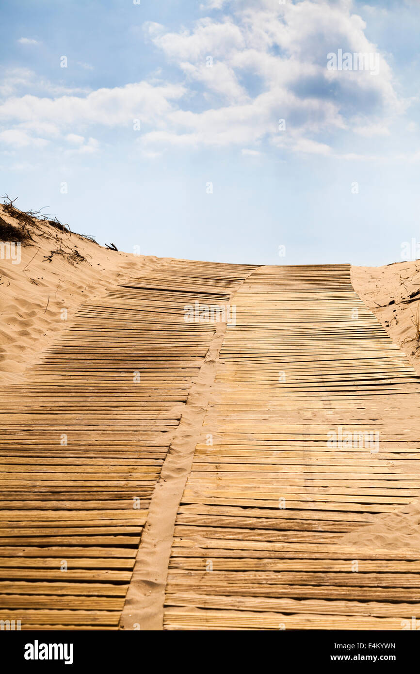 Wooden slatted beach access ramp leading over sand dunes Stock Photo ...