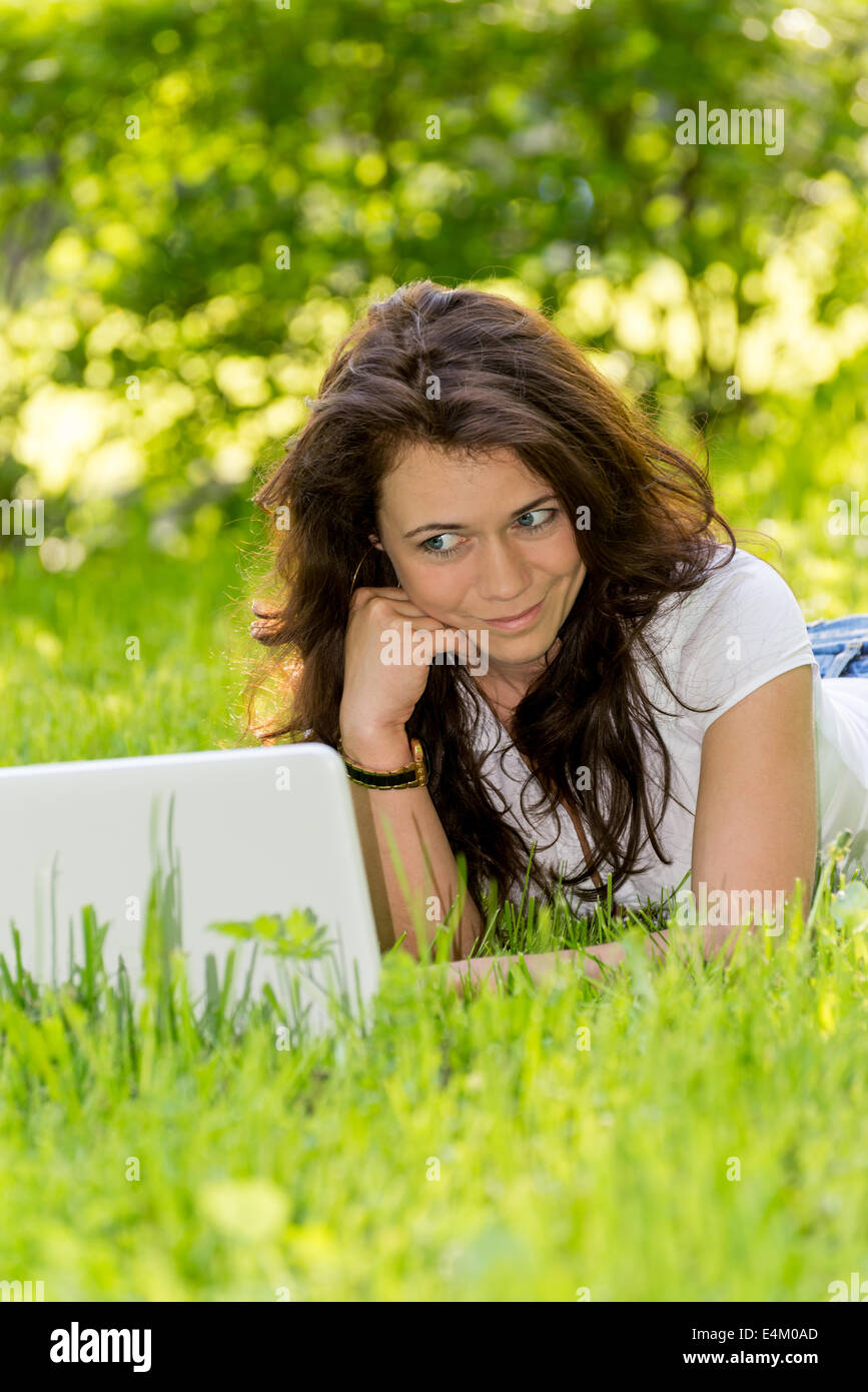 Girl student with a laptop in the park Stock Photo - Alamy