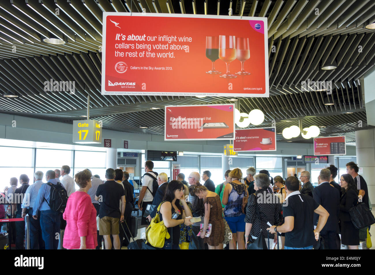 Brisbane Australia,Airport,BNE,domestic,terminal,gate,sign,Qantas,airlines,line,queue,boarding,passenger passengers rider riders,AU140317014 Stock Photo