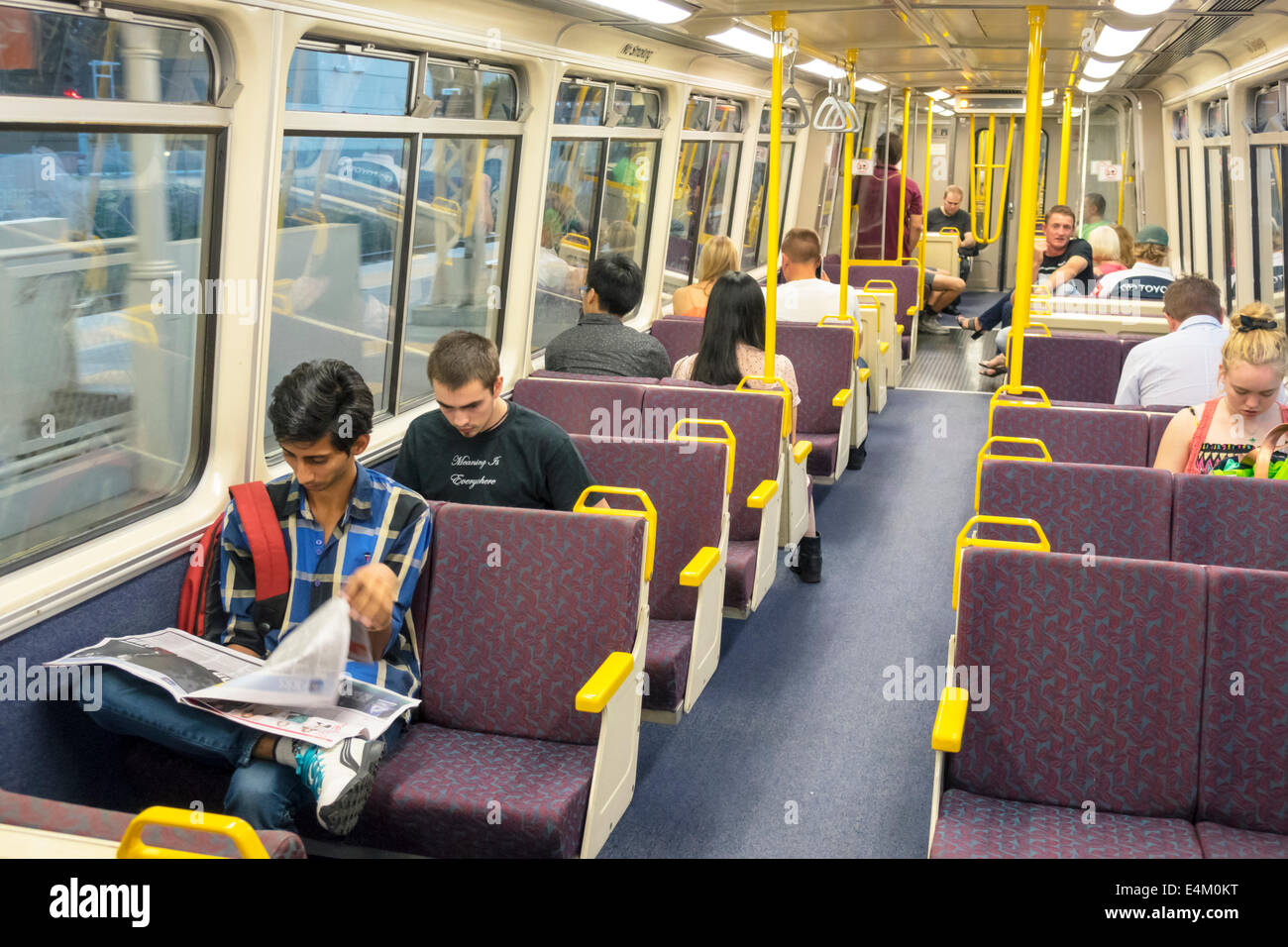 Brisbane Australia,Central Station,public transportation railway station,rail,train,riders,commuters,passenger passengers rider riders,passenger cabin Stock Photo