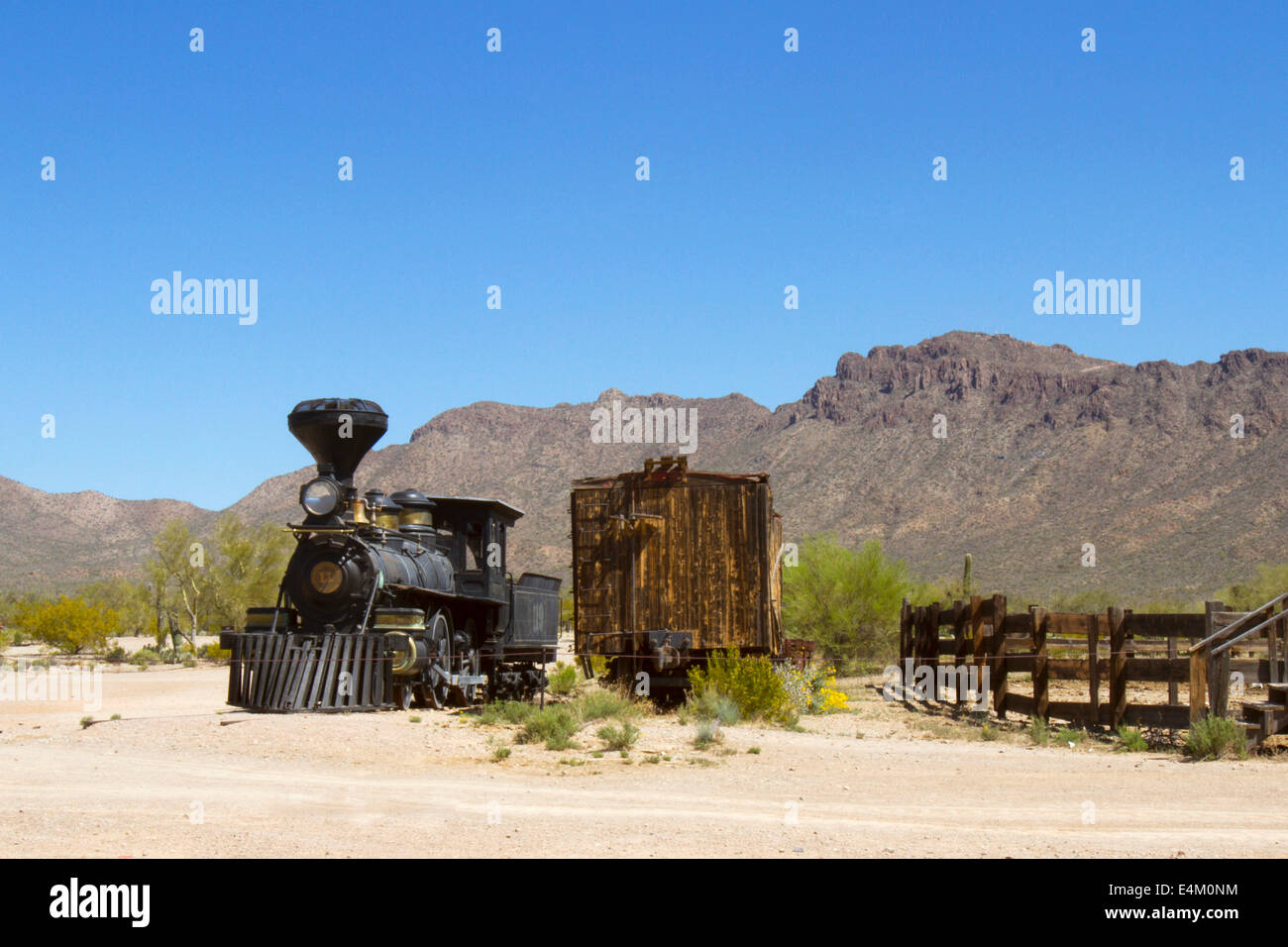 Antique iron train and boxcar in old western setting Stock Photo Alamy