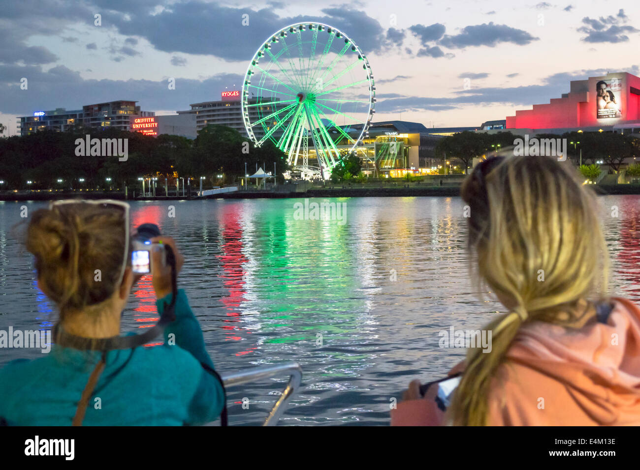 Brisbane Australia,Southbank,The Brisbane Wheel,Ferris,Brisbane River,Queensland Performing Arts Centre,center,dusk,night,CityCat,ferry,boat,TransLink Stock Photo