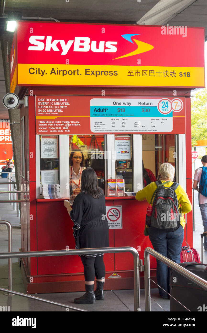 Melbourne Australia,Tullamarine International Airport,MEL,SkyBus,Sky bus,coach,express,ticket booth,sale,customer,transaction paying pays buying buys, Stock Photo