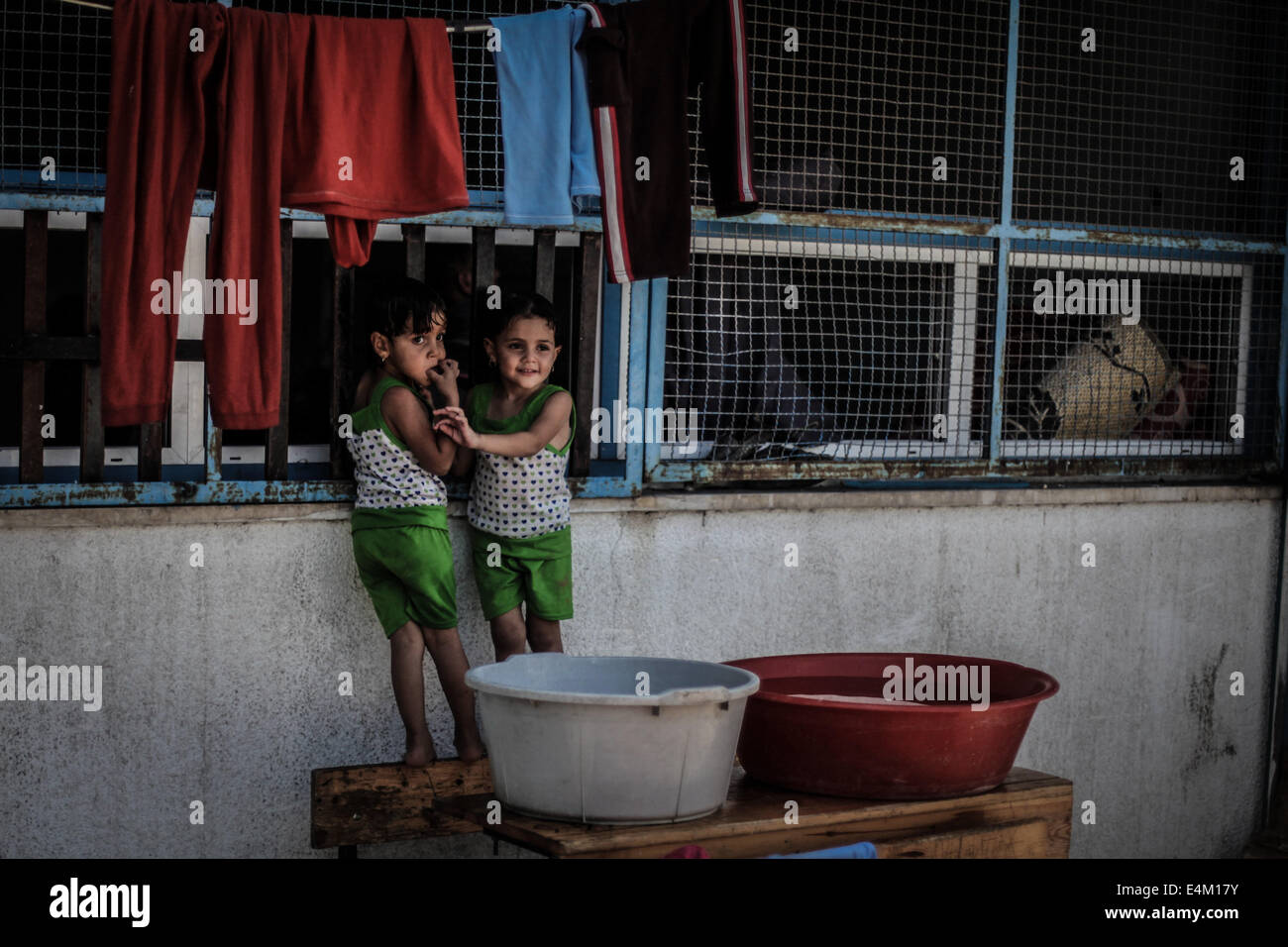 Gaza, Palestinian Territories. 14th July, 2014. Palestinians, who fled their family homes in the northern border town of Beit Lahiya, stay at a United Nations-run school in Gaza City July 14, 2014. Israel appeared to hold off on a threatened escalation of its week-old Gaza Strip barrage on Monday despite balking at Western calls for a ceasefire with an equally defiant Hamas. Credit:  ZUMA Press Inc./Alamy Live News Stock Photo