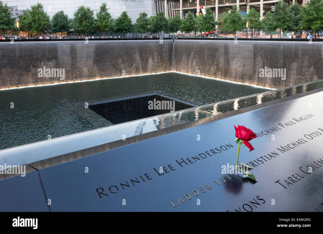 A red rose left on a name of one of the people lost at Ground Zero. This is the North Pool at the World Trade Center Memorial Stock Photo