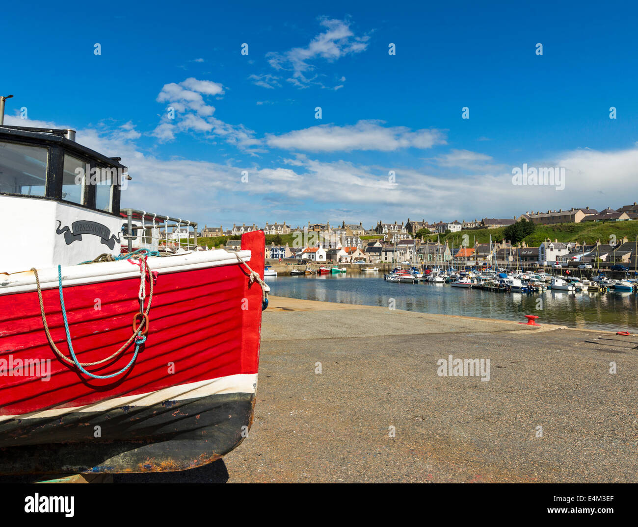 RED BOAT UNDERGOING REPAIRS IN FINDOCHTY HARBOUR MORAY COAST SCOTLAND ...