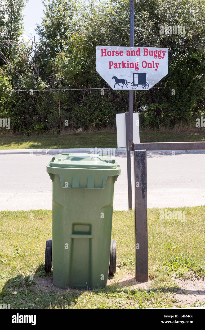 Hitching rail and sign Horse and Buggy Parking Only for the Mennonites at a shopping mall Stock Photo