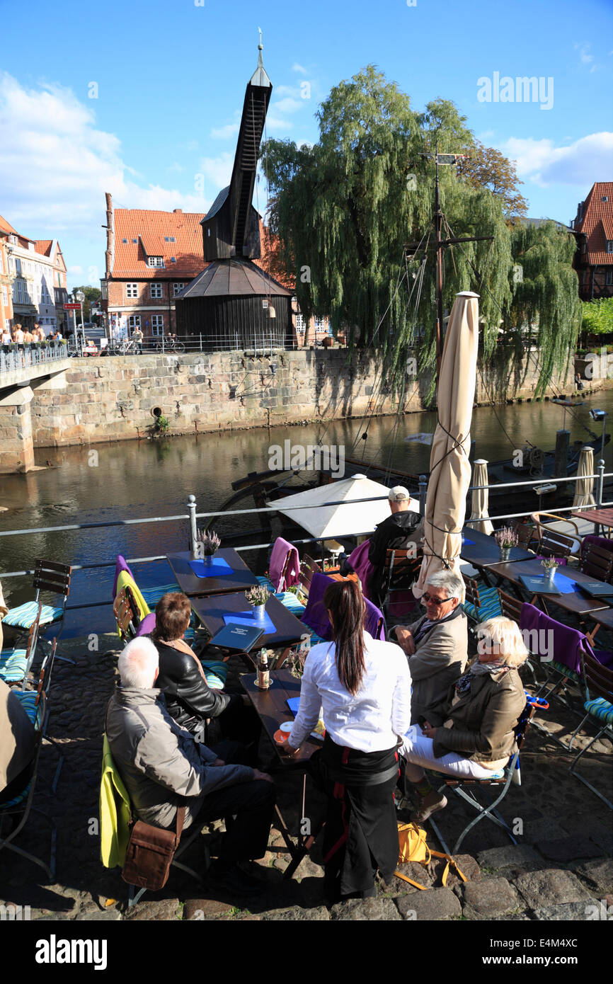 Cafe and restaurant at Stintmarkt in the old harbor of Lueneburg  Lüneburg, at river Ilmenau,  Lower Saxony, Germany, Europe Stock Photo