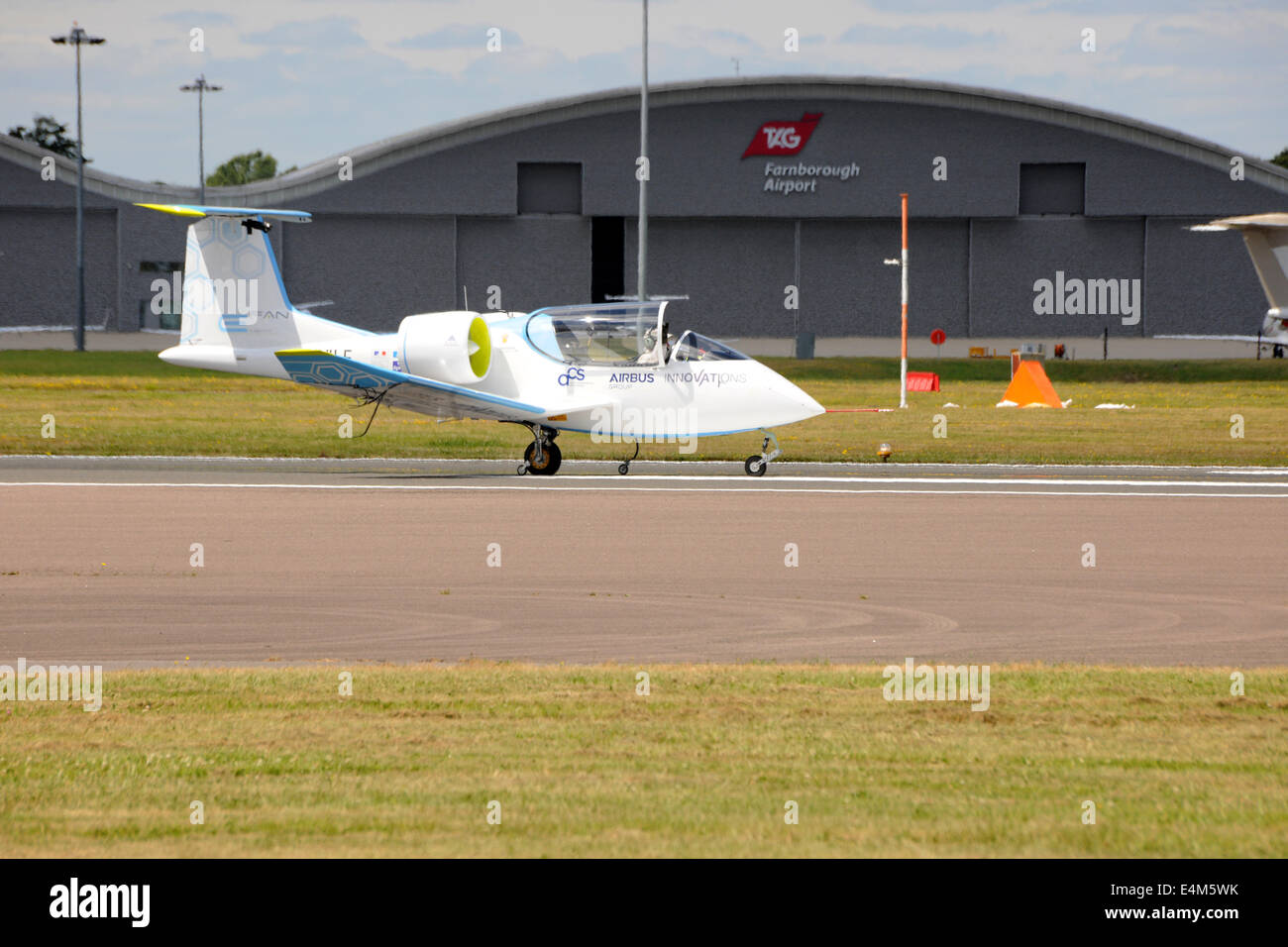 Farnborough, UK. 14th July, 2014. The Airbus E-Fan prototype electric aircraft, being developed by Airbus Group, taxiing at Farnborough International Air Show 14th July 2014 Credit:  Martin Brayley/Alamy Live News Stock Photo
