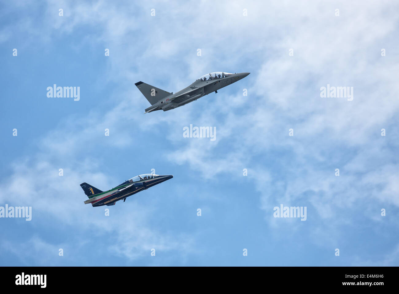 Farnborough, Hampshire, UK. 14th July, 2014. The first day of the 2014 Farnborough International Airshow saw a relatively short flying display that included the Italian Alenia Aermacchi M345, and M346 jet aircraft seen here.  Unfortunately the F-35B STOVL jet is still not cleared to fly to the UK Prime Minister David Cameron visted the show and confirmed British commitment to the UK aero and defence industries. Credit:  Niall Ferguson/Alamy Live News Stock Photo
