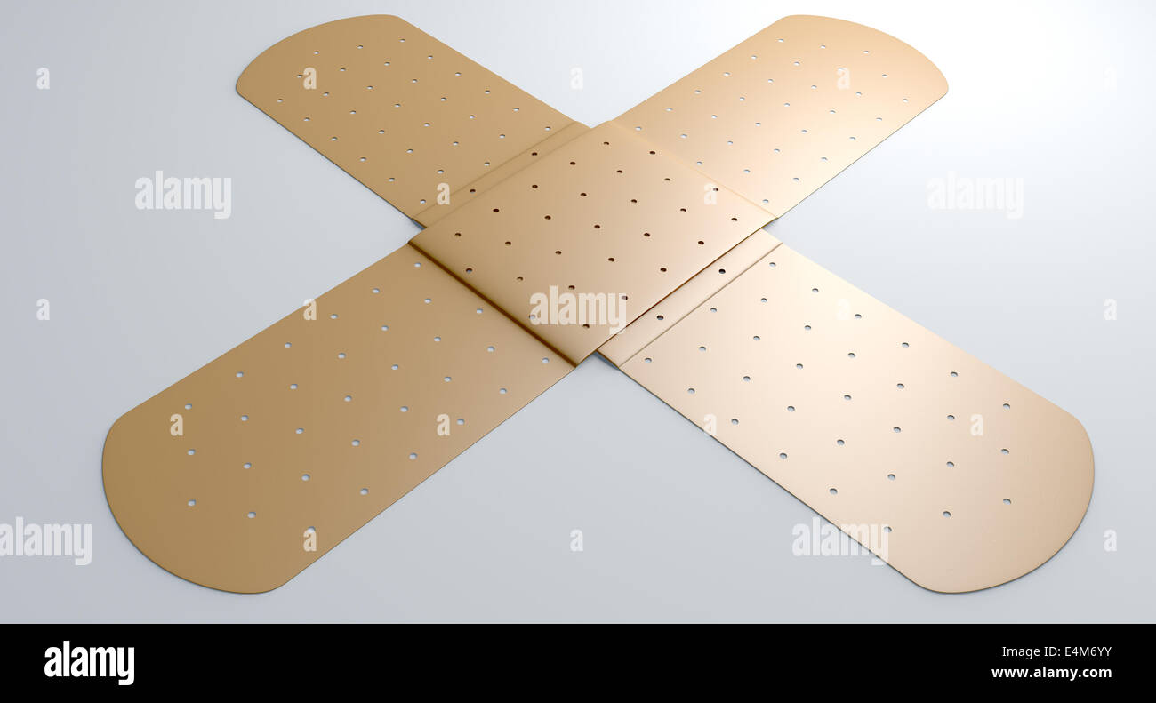 Two regular sticky plasters criss crossed on an isolated white studio ...