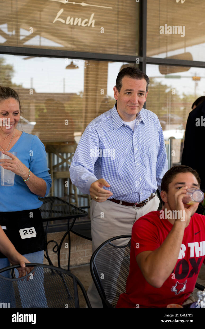 Republican U.S. Senator Ted Cruz  (center) visits with constituents in downtown Fredericksburg, Texas. Stock Photo