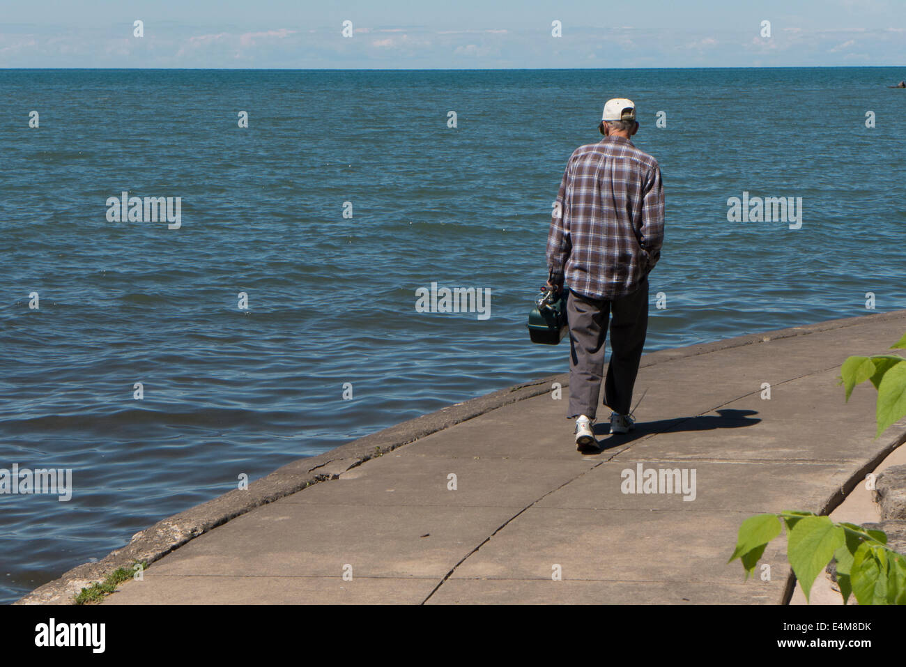 Older man walking alone hi-res stock photography and images - Alamy