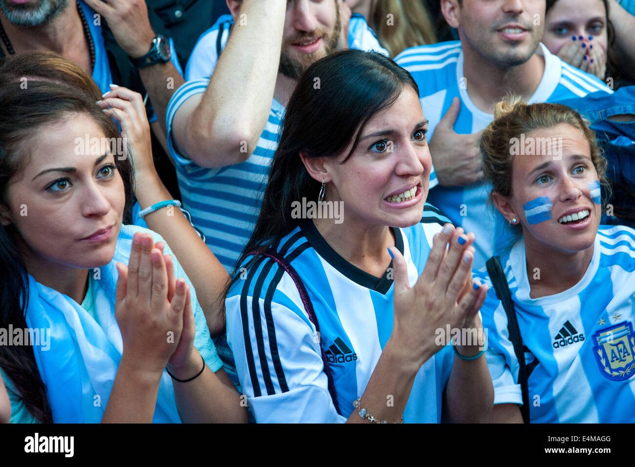 London, UK. 13th July, 2014. Two women pray as Argentina fans in the Moo  Cantina, Pimlico watch the World Cup 2014 final against Germany. Credit:  Pete Maclaine/Alamy Live News Stock Photo - Alamy