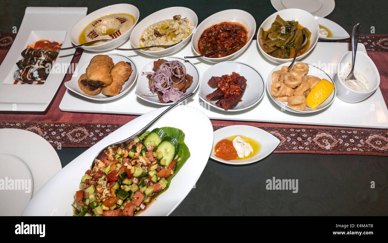 Appetizers in Turkish restaurant, Lalezar, in Jumeirah Zabeel Saray on Palm Island, a deluxe hotel in Dubai, UAE. Stock Photo