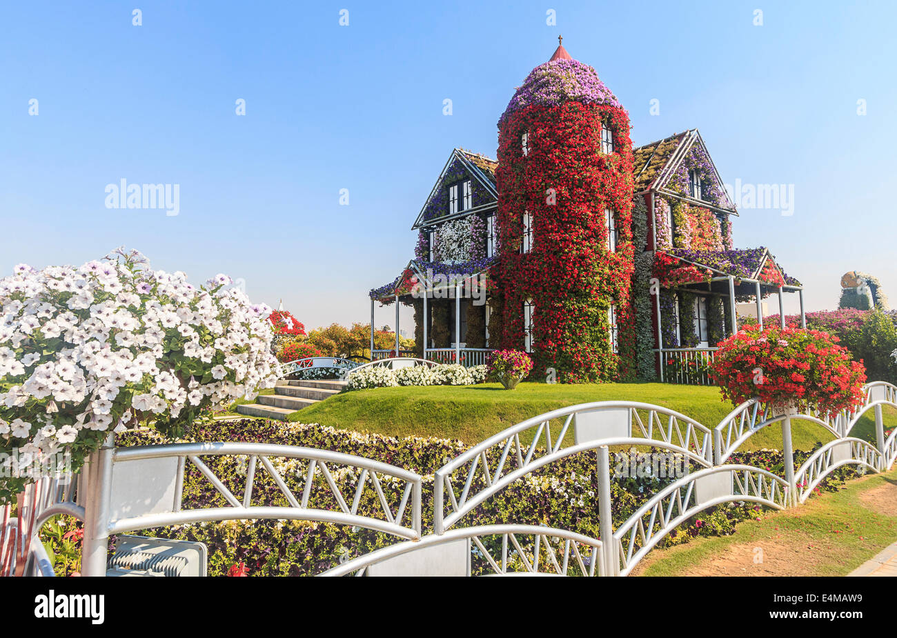 House covered in flowers at Dubai's Miracle Garden, largest natural flower garden in the world Stock Photo