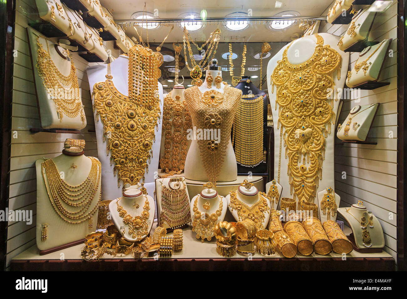 Gold jewelry in Dubai's gold souk. The gold souk consists of over 300 retailers that trade almost exclusively in jewelry. Retail Stock Photo