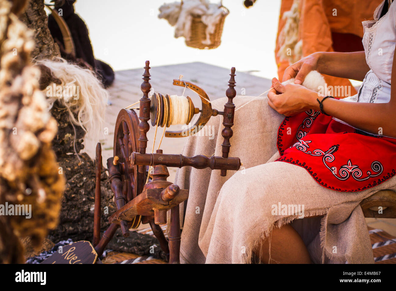 distaff, woman spinning yarn on an old spinning wheel Stock Photo Alamy