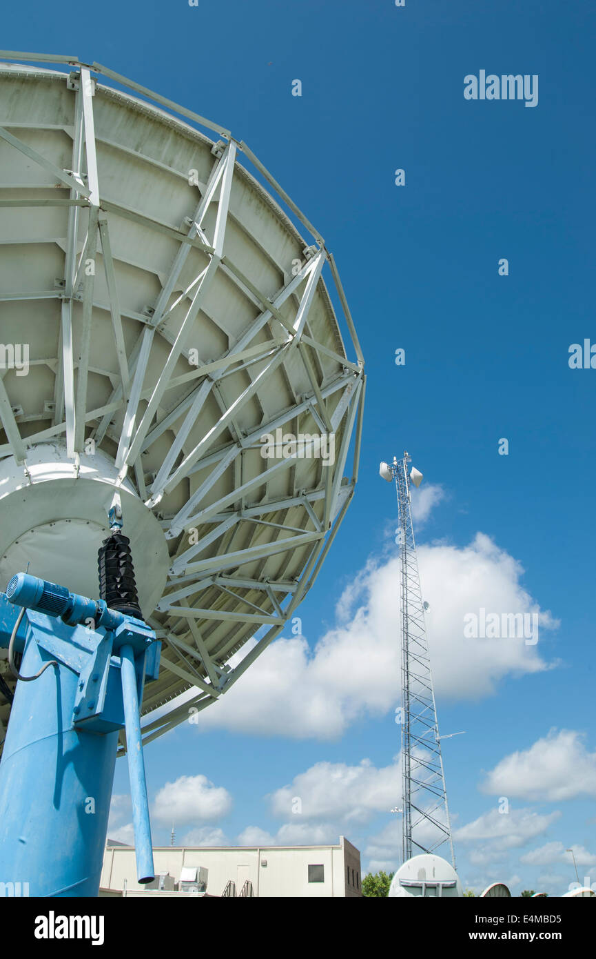 Satellite dish and microwave tower at television station Stock Photo