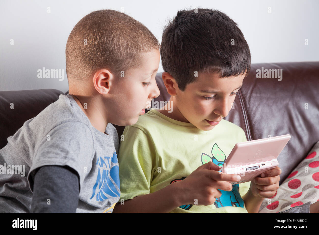 Boys playing computer game Stock Photo