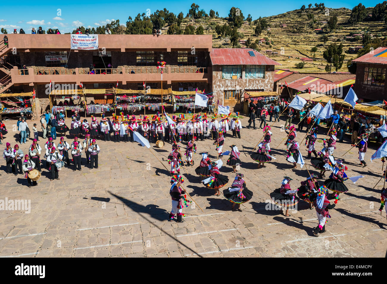 Puno, Peru - July 25, 2013: musicians and dancers in the peruvian Andes at Taquile Island on Puno Peru at july 25th, 2013. Stock Photo