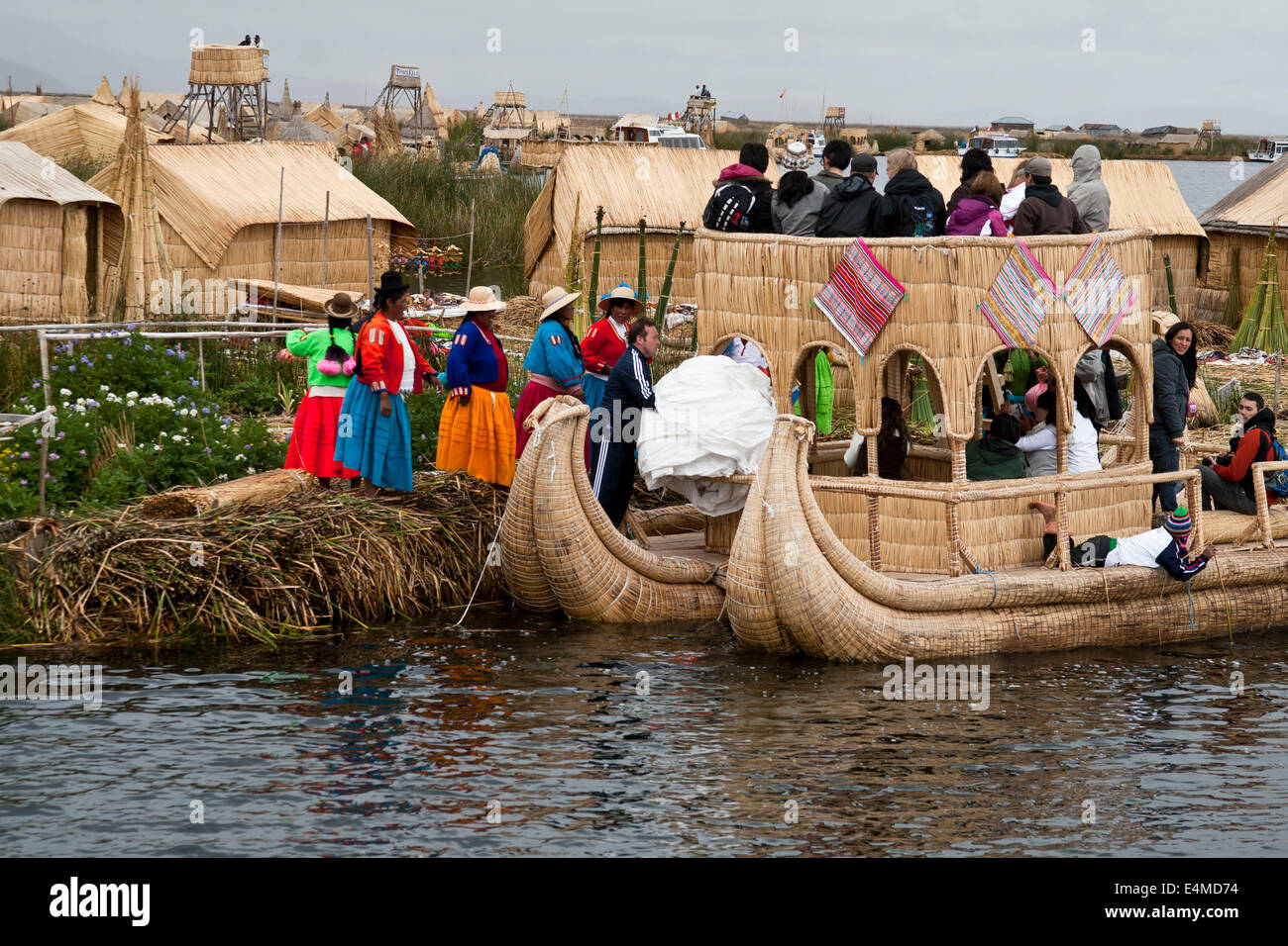 Lake Titicaca, shared by Peru and Bolivia, is the cradle of ancient ethnic and indigenous groups that inhabit the edges and thus Stock Photo