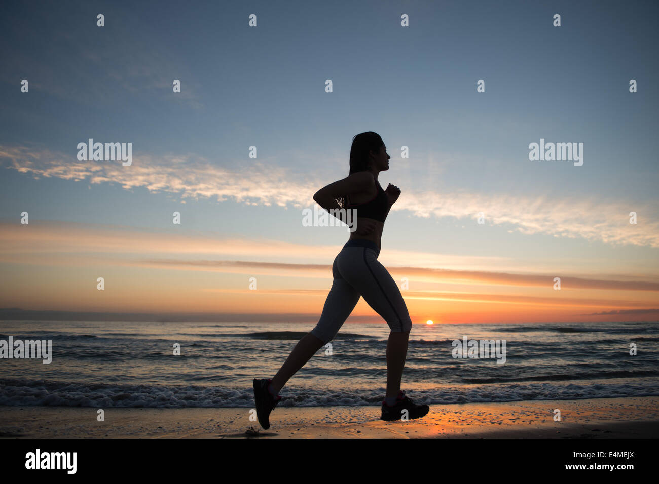 Young Girl Running On The Beach Stock Photo Alamy