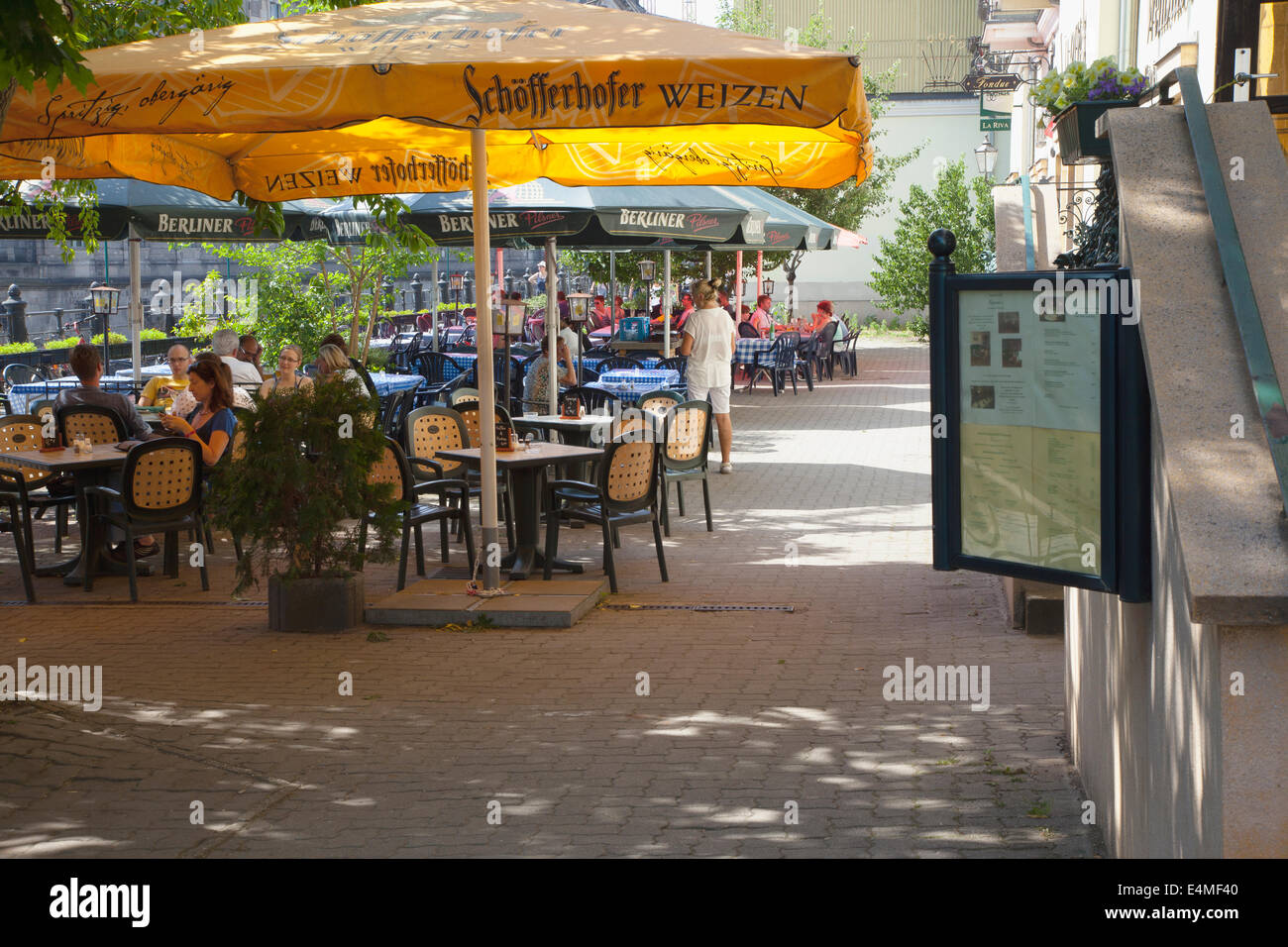 Germany, Berlin, Mitte, Cafes, restaurants and bars under leafy shade on the banks of the river Spree. Stock Photo