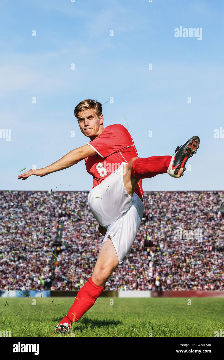 Soccer Player Kicking Stock Photo