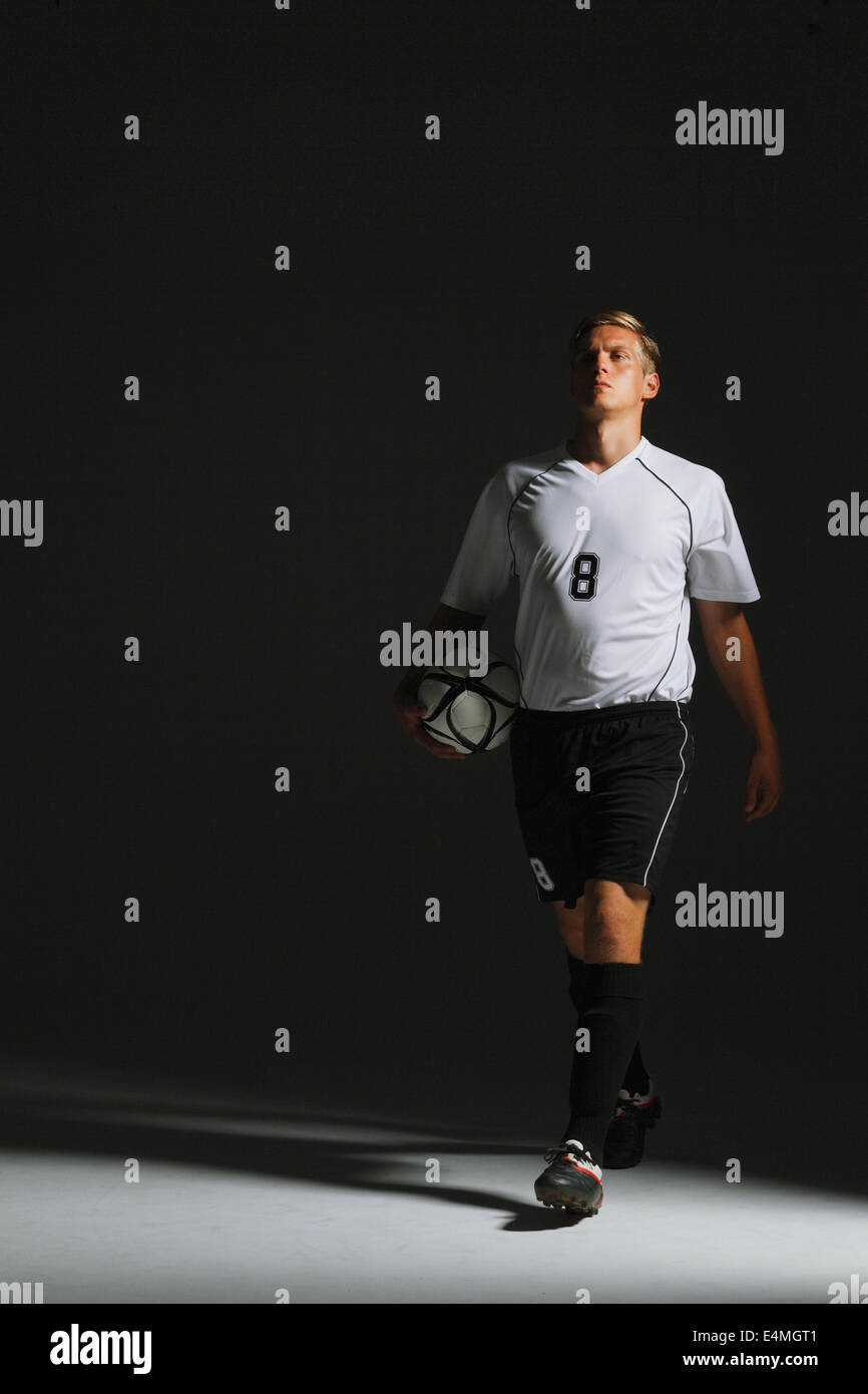 Soccer Player Walking With Ball Stock Photo Alamy