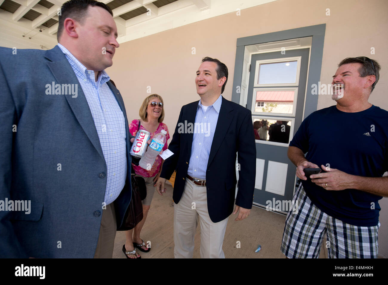 Republican U.S. Senator Ted Cruz  (center) talks to constituents in the central Texas town of Fredericksburg. Stock Photo