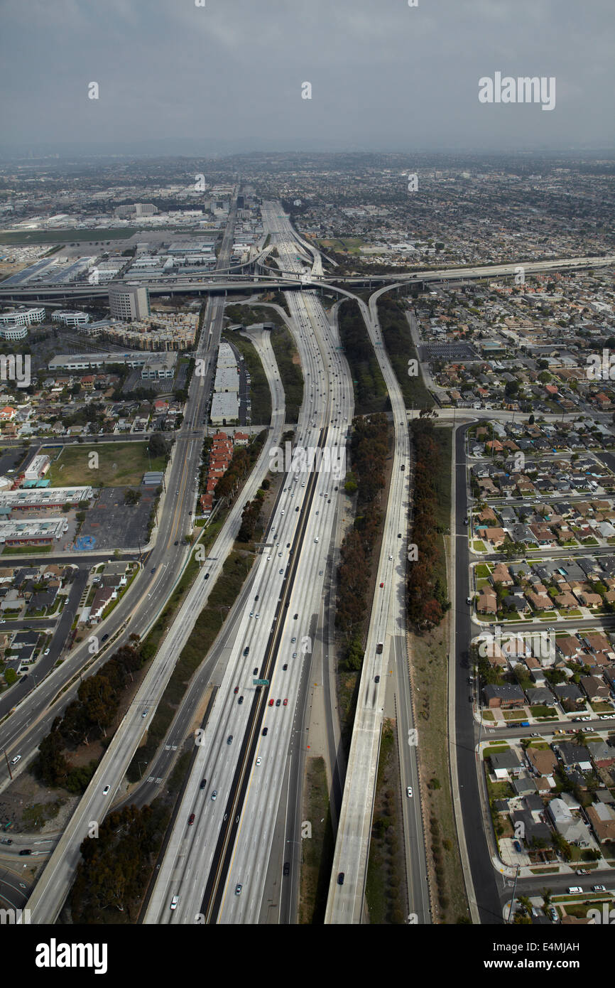 Interstate 405 near LAX, and interchange with I-105 in distance, Hawthorne, Los Angeles, California, USA - aerial Stock Photo