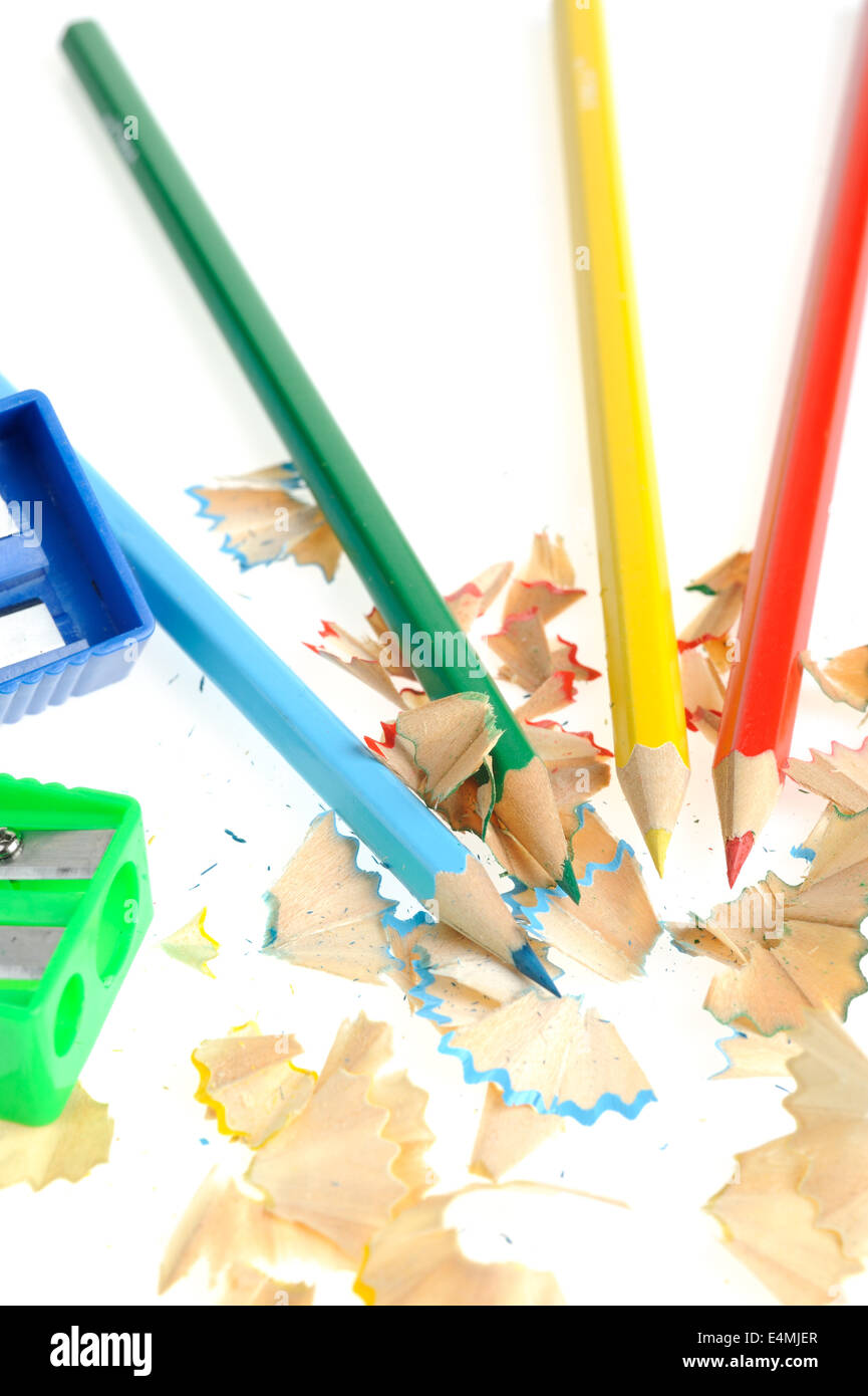 Top view of colored pencils with shavings and pencil sharpener over white  background. top view Stock Photo - Alamy