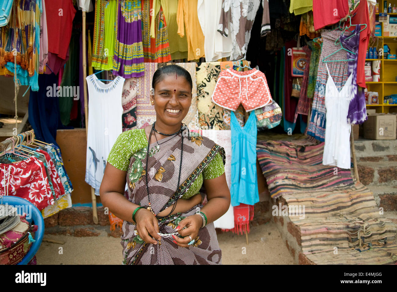 Sunita in front of her shop on Palolem Beach, Goa. Stock Photo