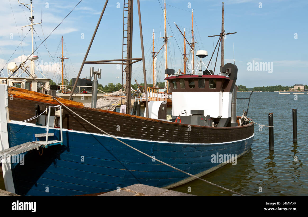 Wooden blue boat in the port Stock Photo - Alamy