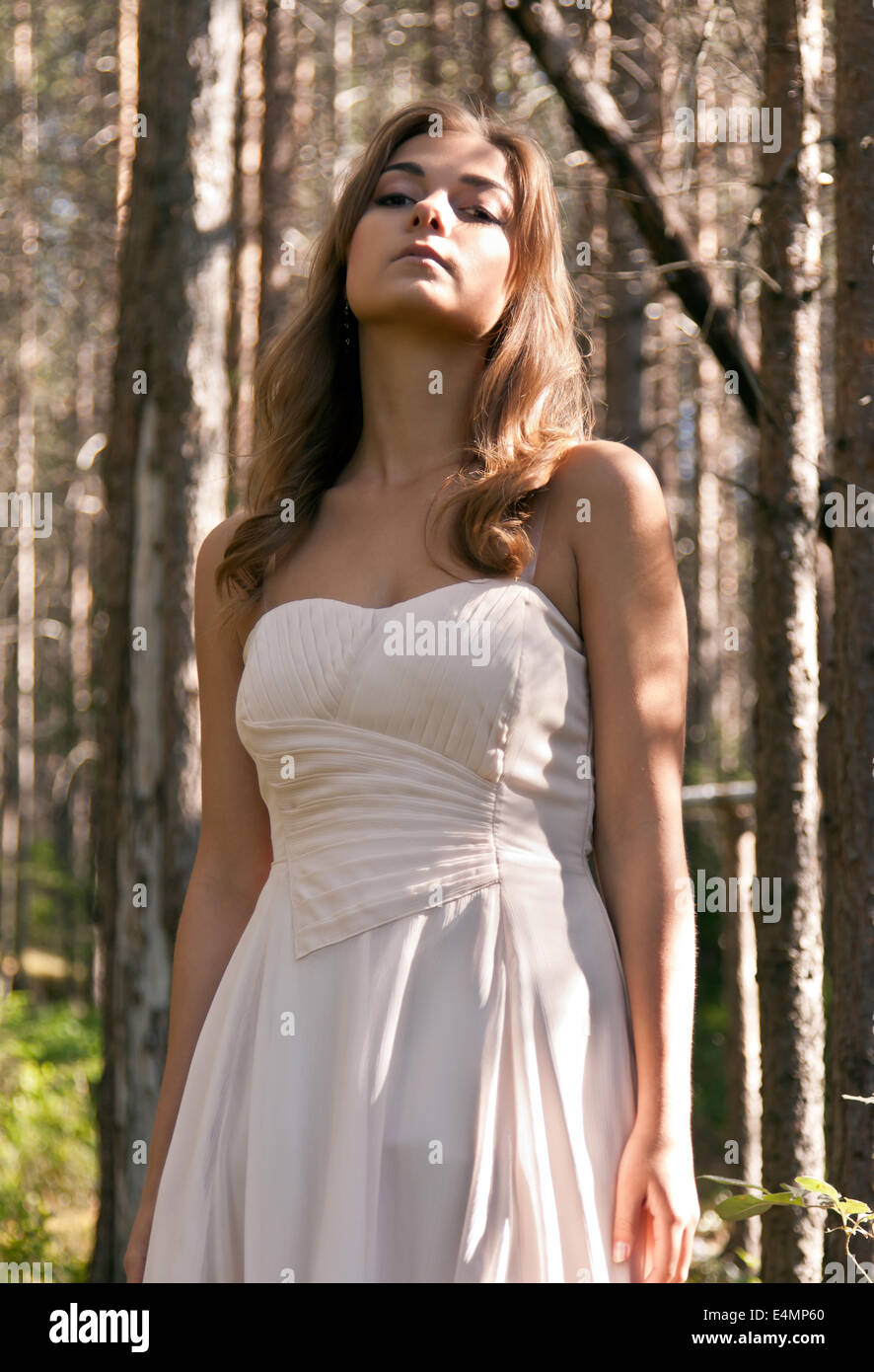 girl in a dress in a forest Stock Photo - Alamy