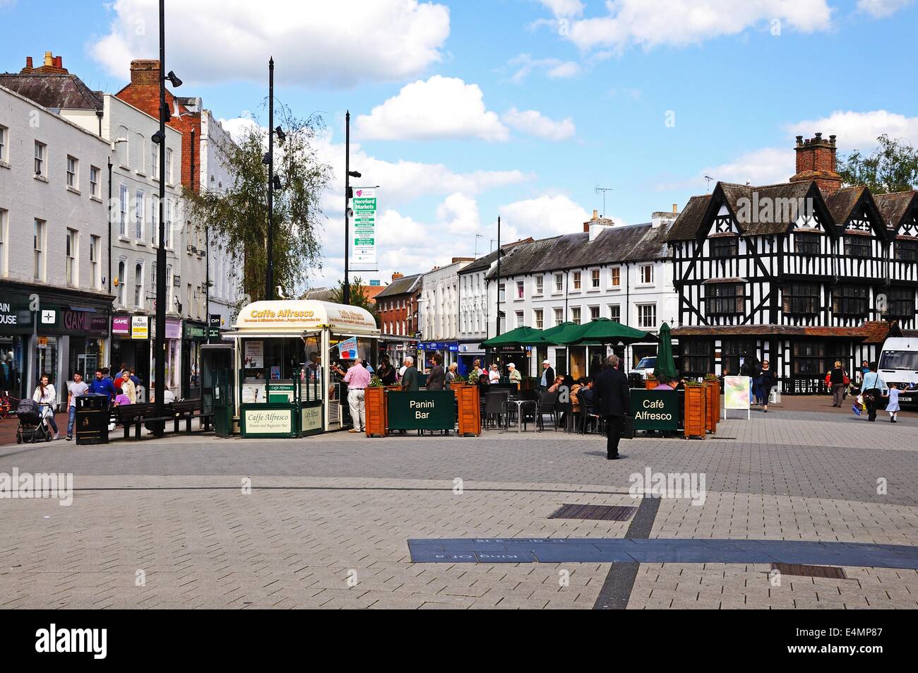View of shopping area in the centre of the city with a pavement cafe and the High House in High Town Built in 1621, Hereford, UK Stock Photo