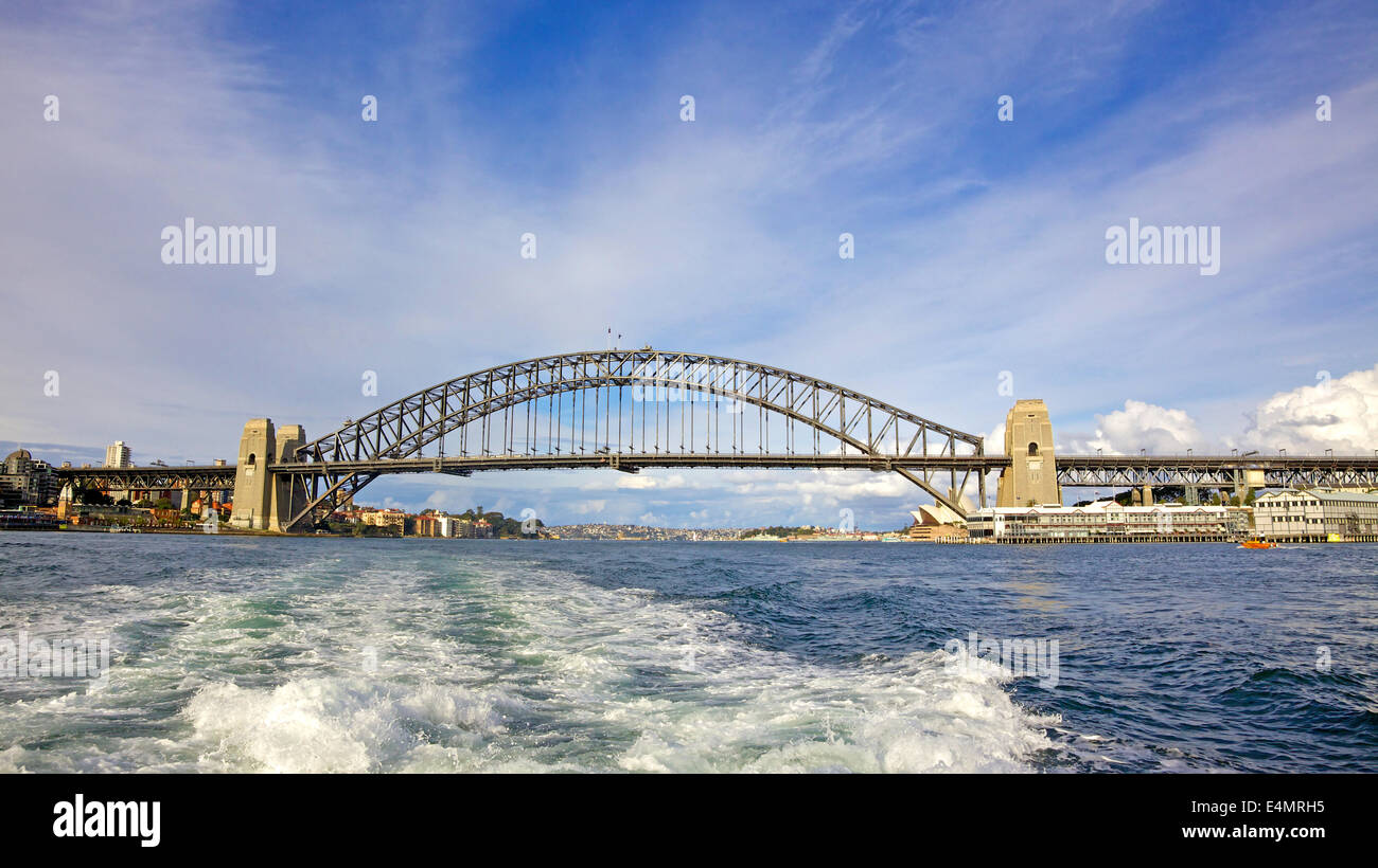 The iconic Sydney Harbour Bridge is a steel arch bridge across Sydney Harbour in Australia. Stock Photo