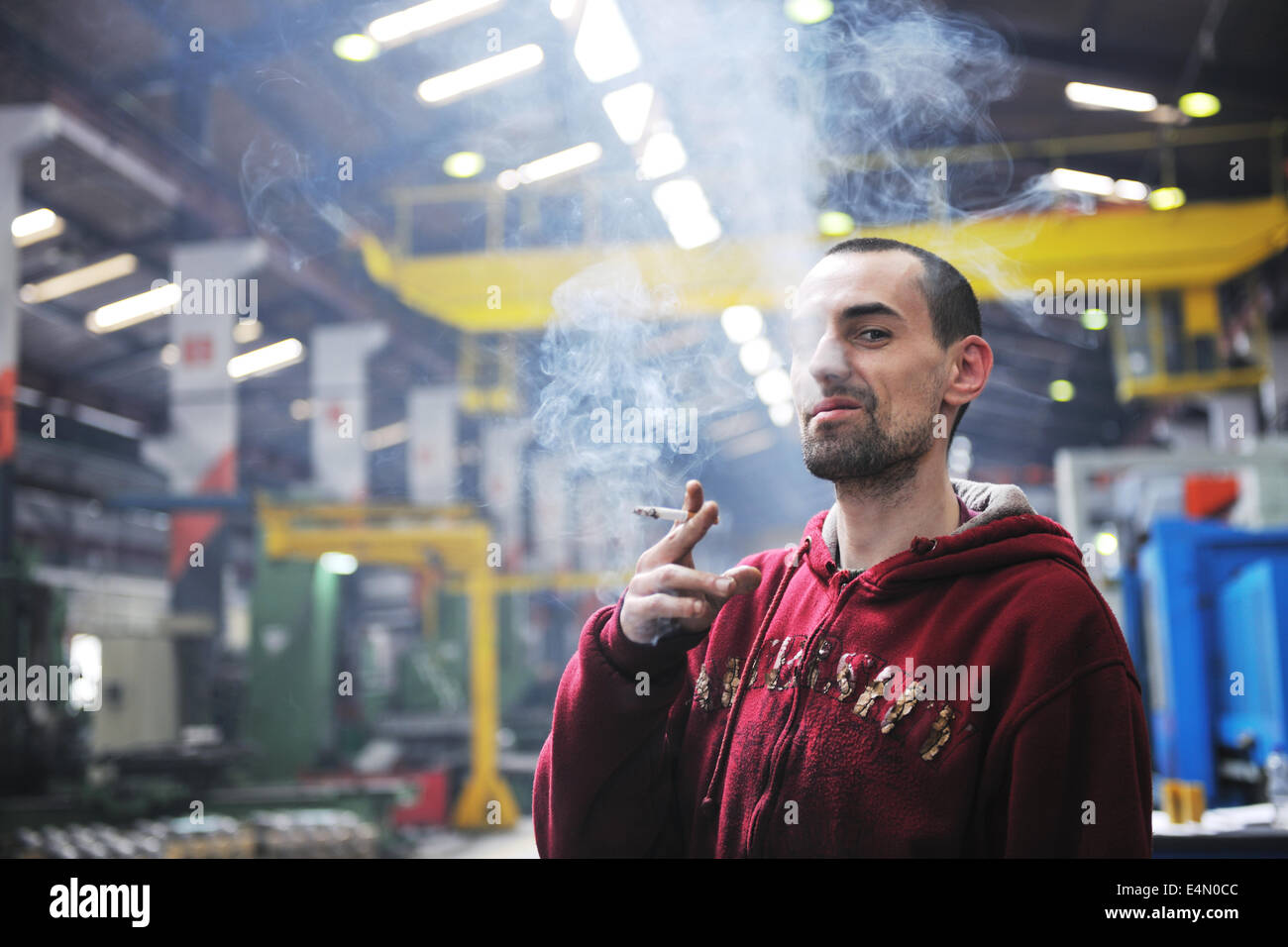 industry worker smoke cigarette Stock Photo